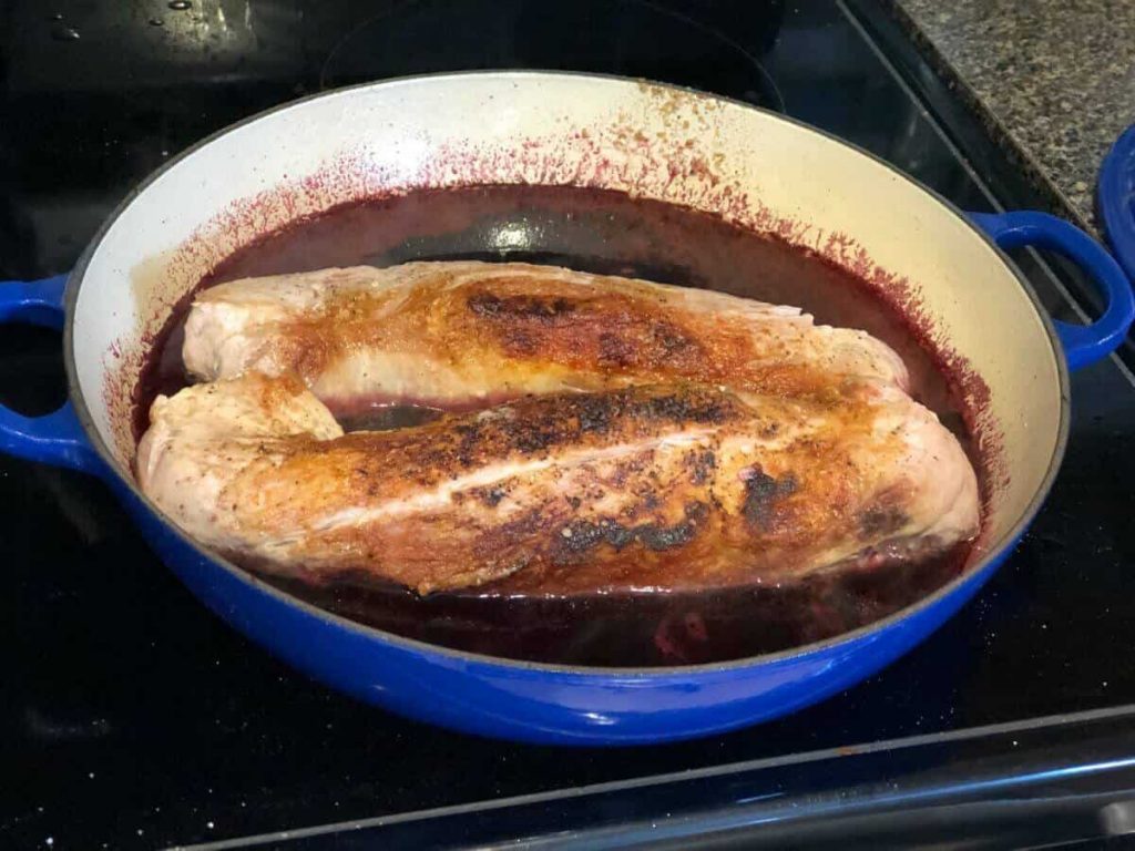 Pork tenderloin in blackberry sauce, ready to bake