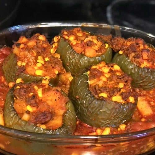 Stuffed Peppers recipe baked and ready to eat in a glass casserole dish