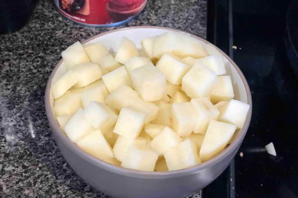 Diced raw potatoes in a bowl