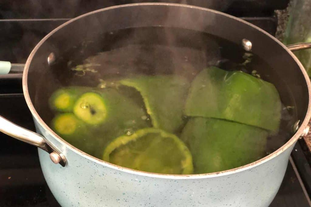 Bell peppers par-boiling in a pot of boiling water