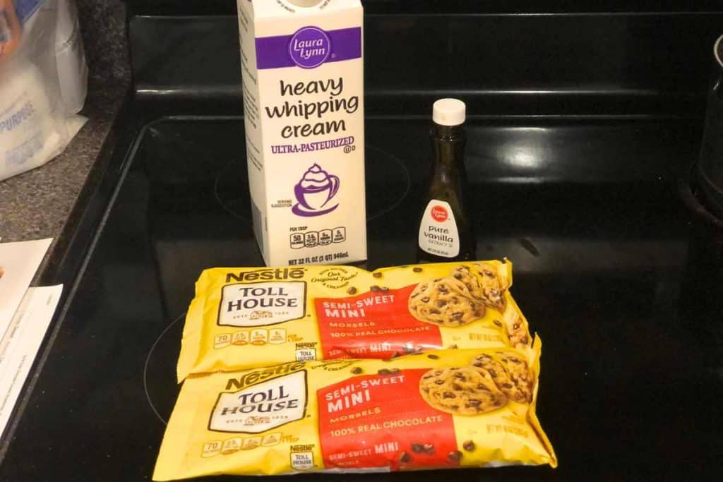 Ingredients for 3-ingredient chocolate truffles including heavy cream, vanilla extract and chocolate chips.