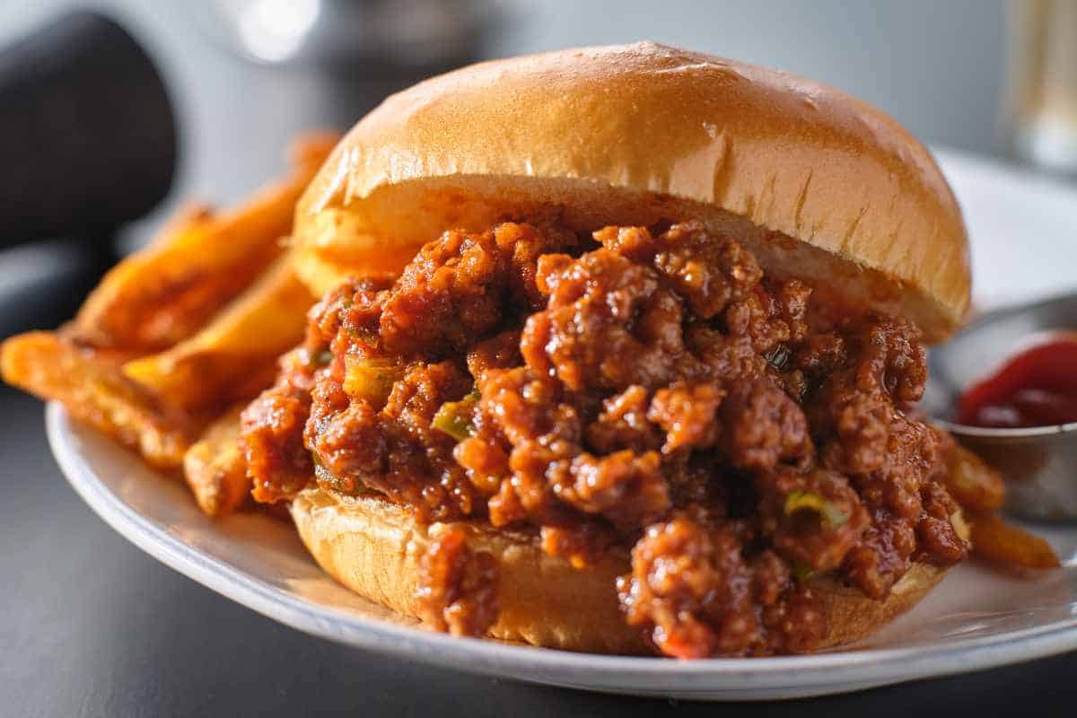 Classic 1950's Sloppy Joe recipe on a toasted bun with french fries and ketchup on the side