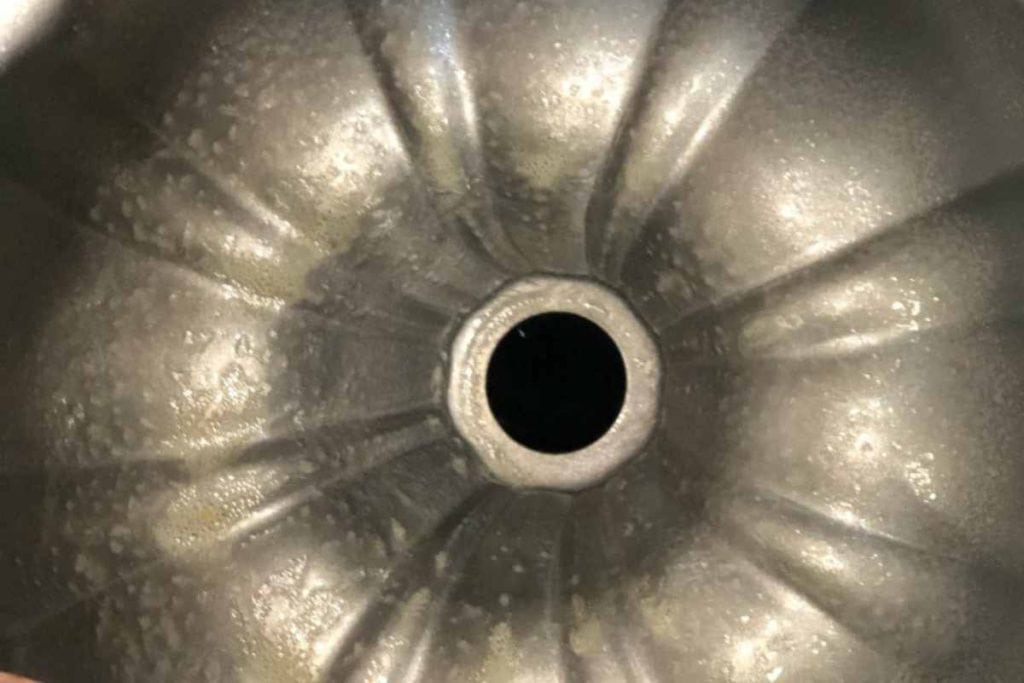 Greased bundt cake pan for use in the baking of the lemon pound cake