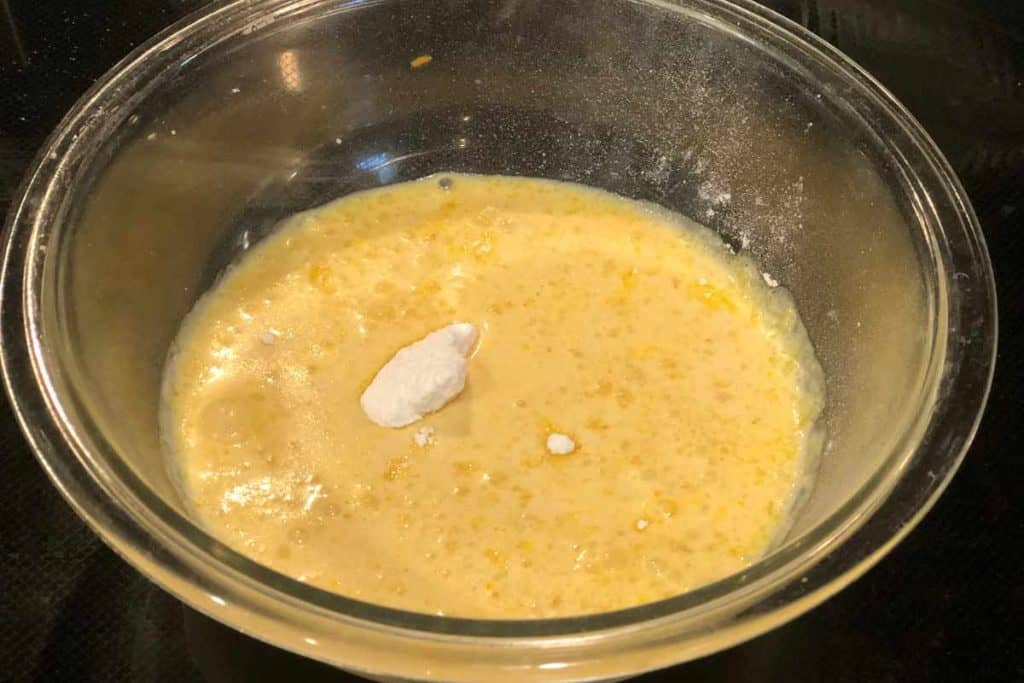 Evaporated milk and pudding mix in a glass bowl