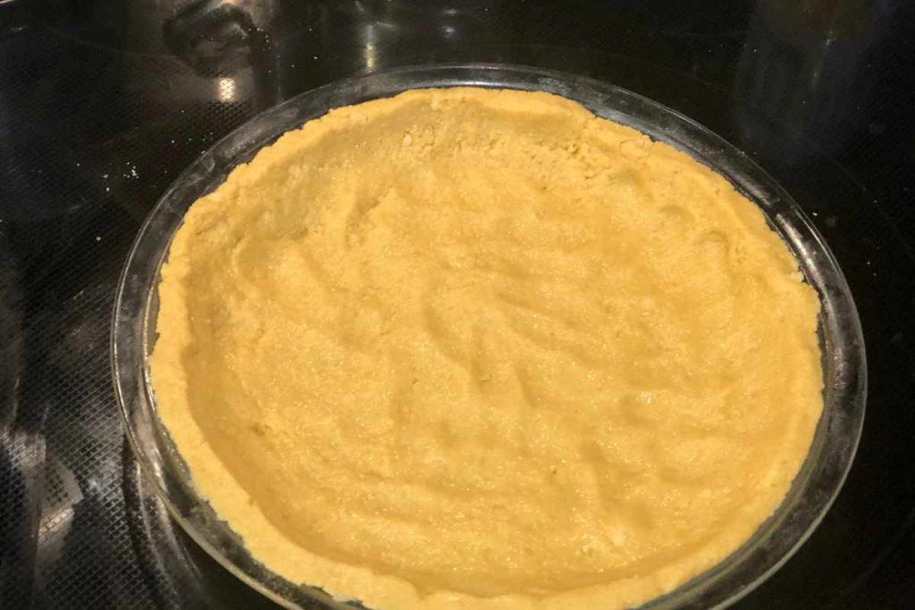 Crust spread into the pie pan ready to bake