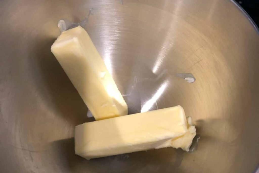 2 sticks of margarine in a stainless steel mixing bowl
