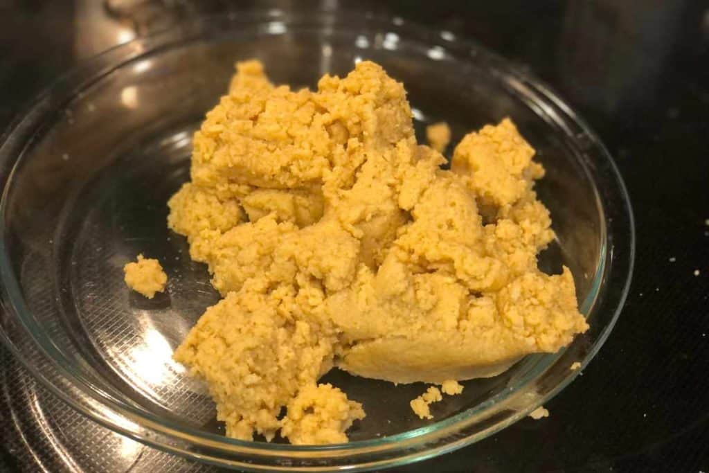 Butter added to lemon Oreo crumbs to make a crust