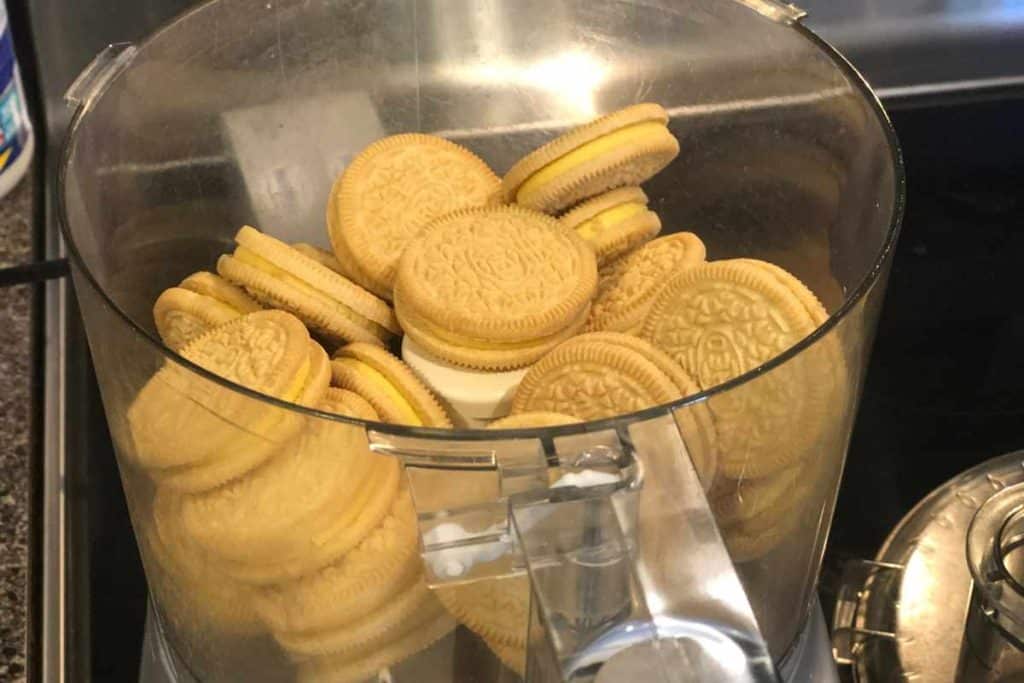 Lemon Oreos in a food processor for No-Bake Lemonade Cheesecake crust
