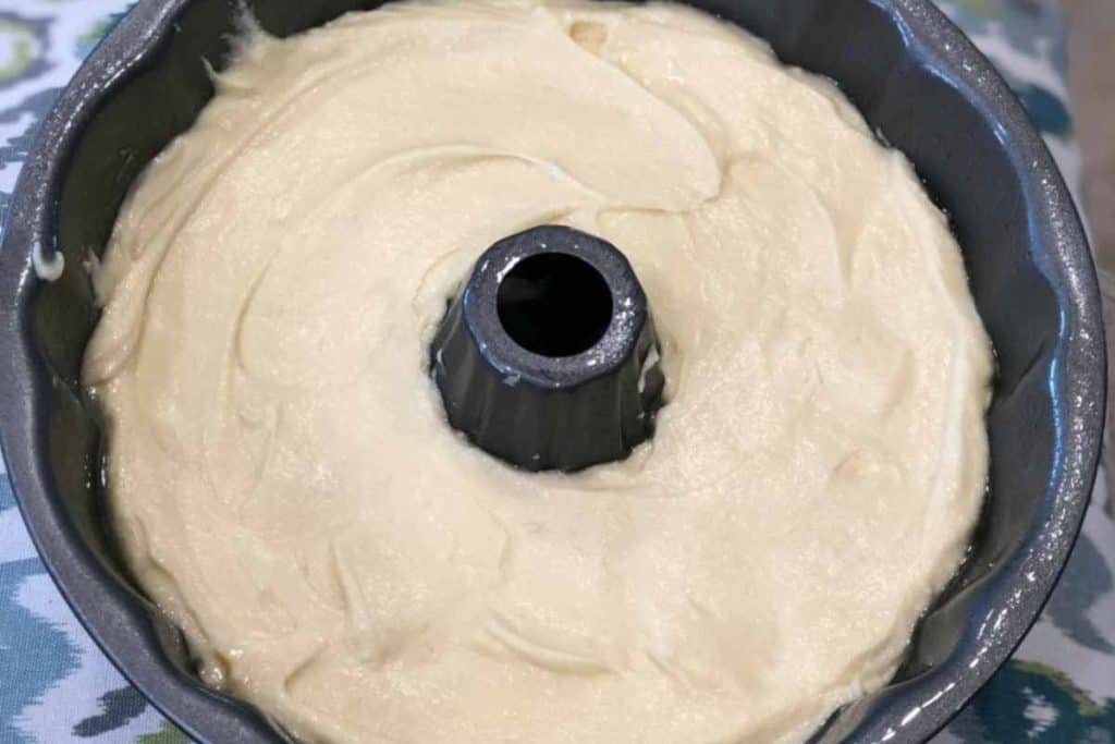 Lemon Pound Cake batter in a bundt cake pan ready to be put in the oven to bake