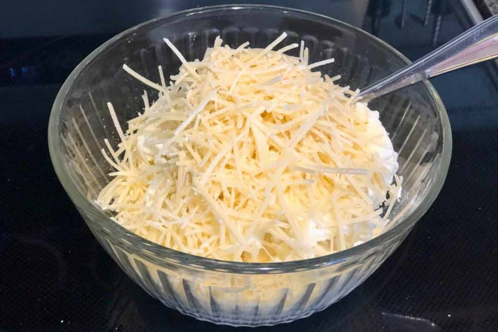 Parmesan cheese added to ricotta and cottage cheese mixture