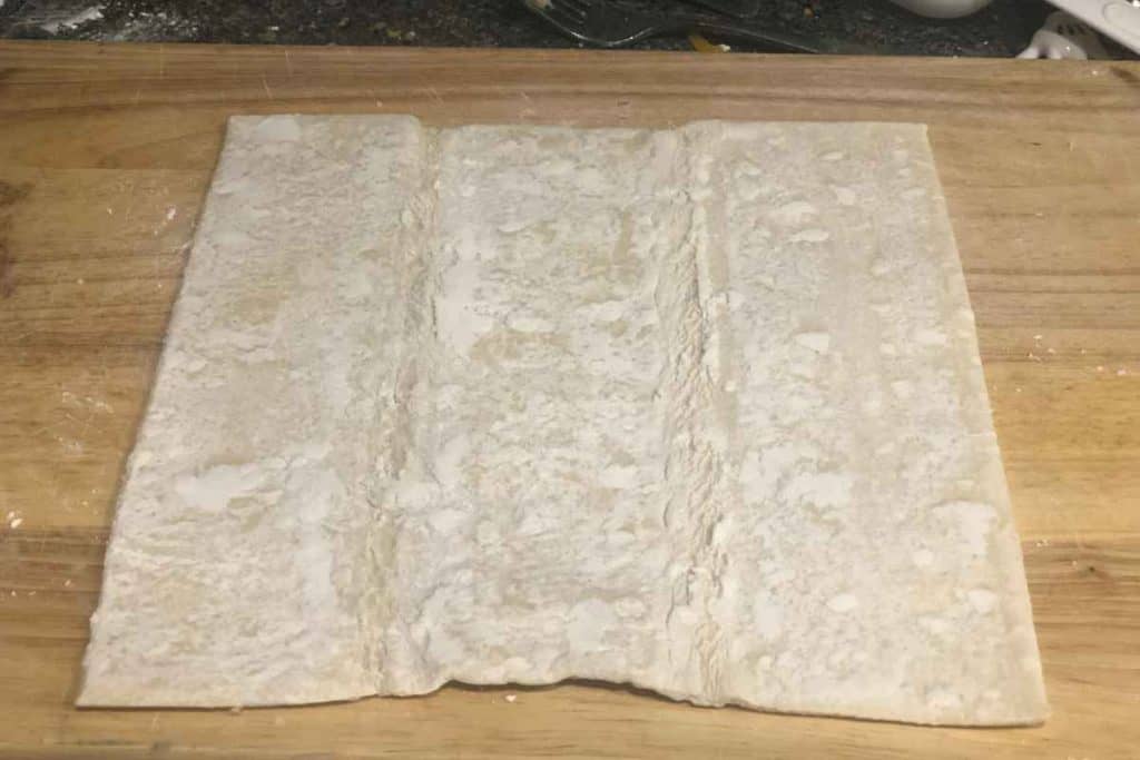 Sheet of puff pastry on a cutting board