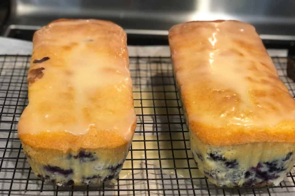 Blueberry Lemon Loaf glazed and cooling on a wire cooling wrack