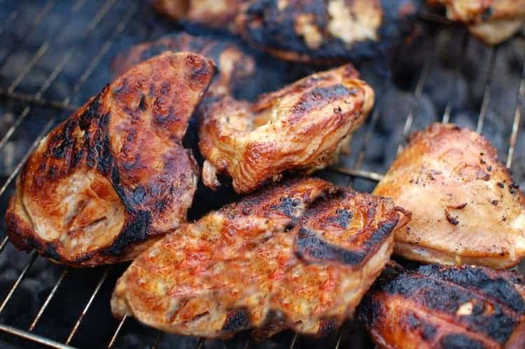 Grilled chicken with sauce on a grill for Cornell Chicken BBQ