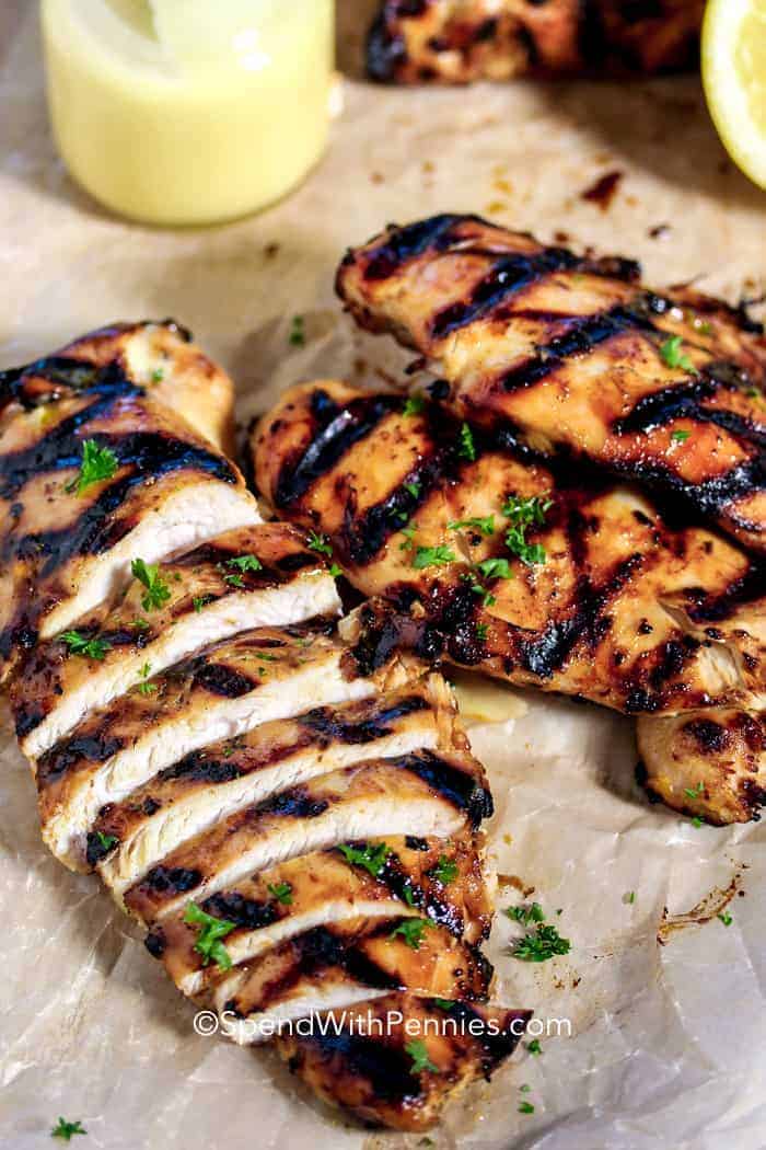 Grilled Honey Mustard Chicken on parchment paper and sliced.