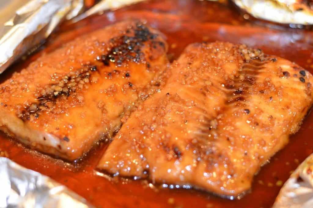 Honey Teriyaki salmon finished under broiler and ready to eat with foil peeled back