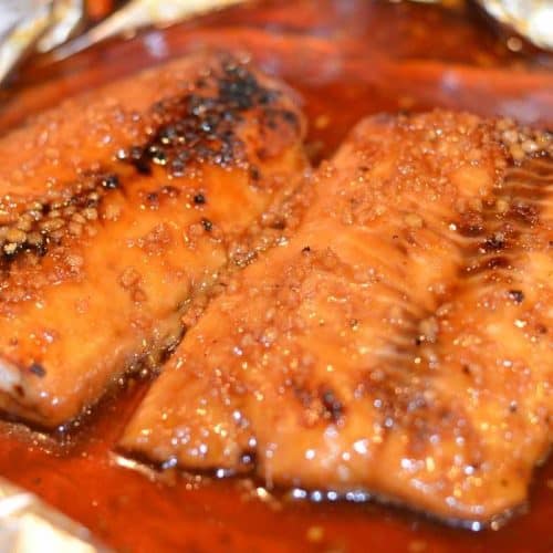 Honey Teriyaki salmon finished under broiler and ready to eat with foil peeled back