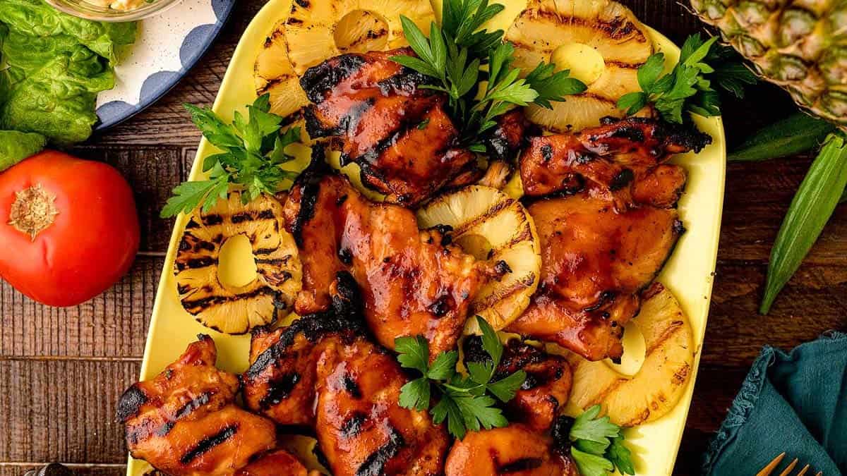 Hawaiian BBQ Chicken on a platter with grilled pineapple