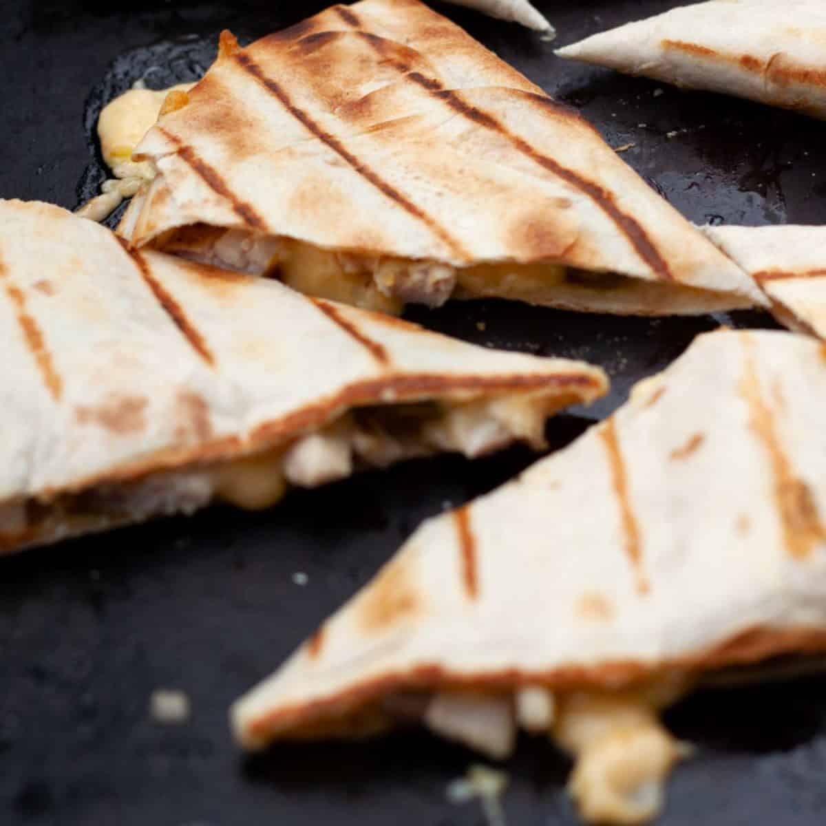 Grilled Chicken Quesadilla on an iron skillet