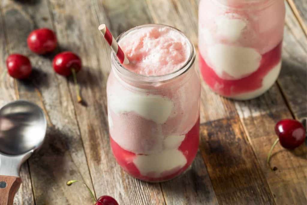 Cherry ice cream float with vanilla ice cream and cherries