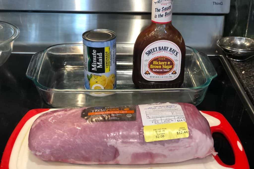 Ingredients for Lemonade BBQ Pork Chops, including a pork loin, lemonade concentrate and a bottle of bbq sauce