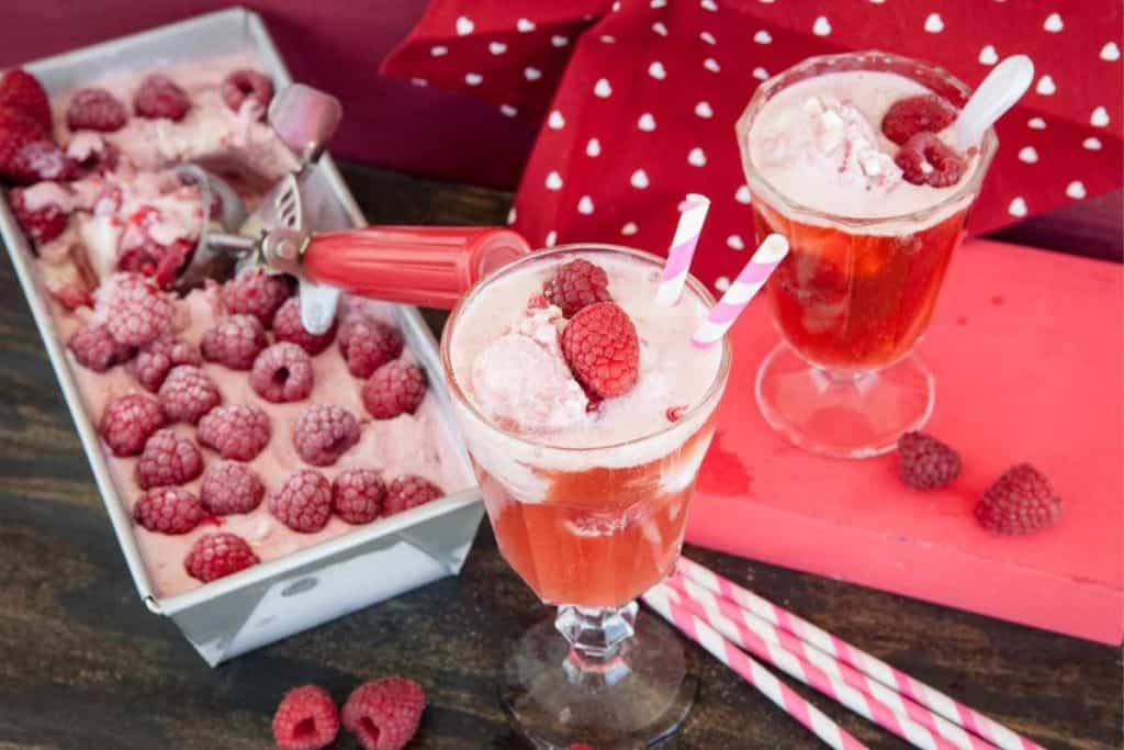 Raspberry ice cream float with raspberry soda and raspberry ice cream.