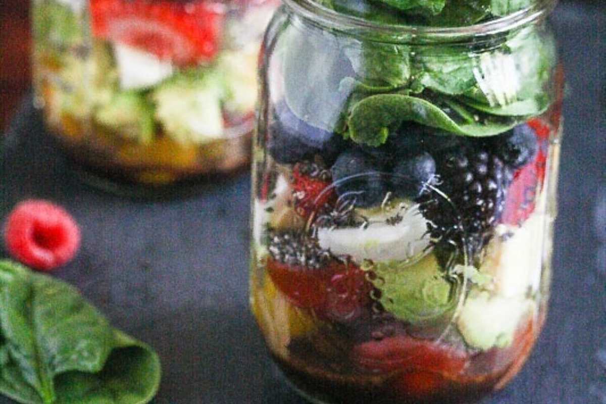 Berries and salad fixing in a mason jar