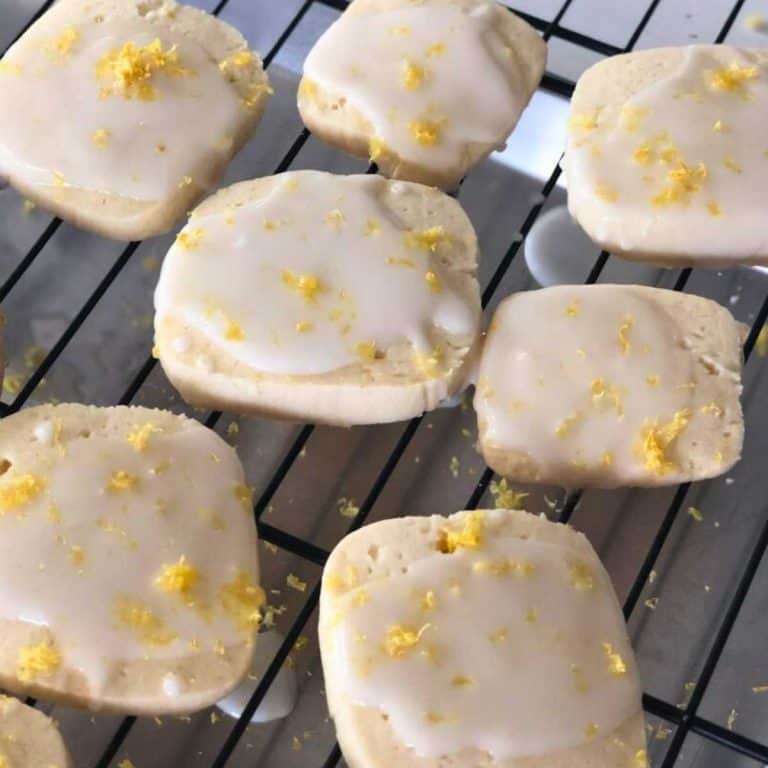 Iced lemon shortbread cookies on a cooling rack