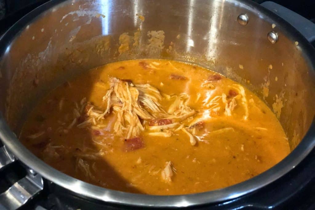 3-Jar Slow-Cooker Creamy Tomato Chicken shredded in the slow cooker after it's finished cooking