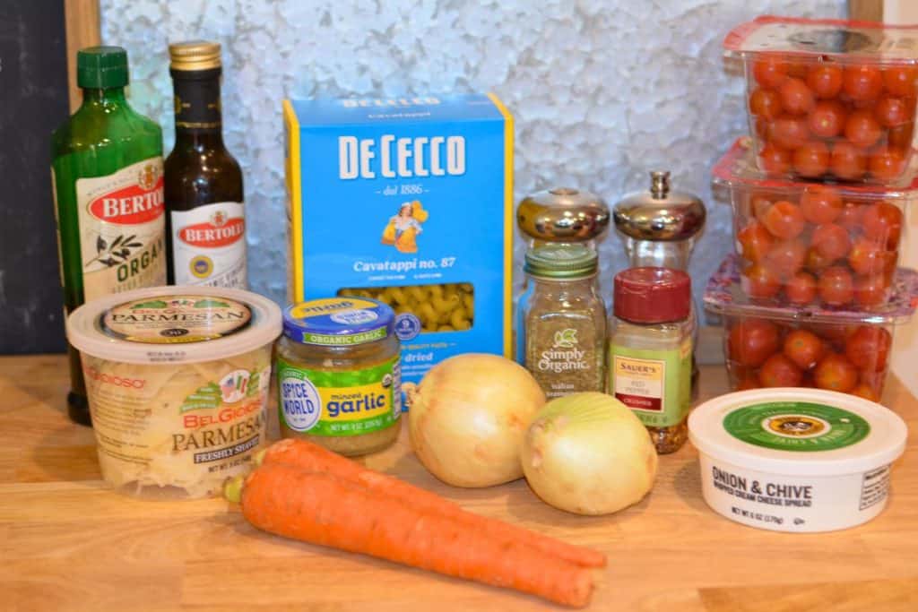 Ingredients for Roasted Cherry Tomato Pasta Sauce including cherry tomatoes, cream cheese, salt, pepper, crushed red pepper, Italian seasoning, Onions, carrots, minced garlic, cavitappi pasta, parmesan cheese, balsamic vinegar and extra virgin olive oil