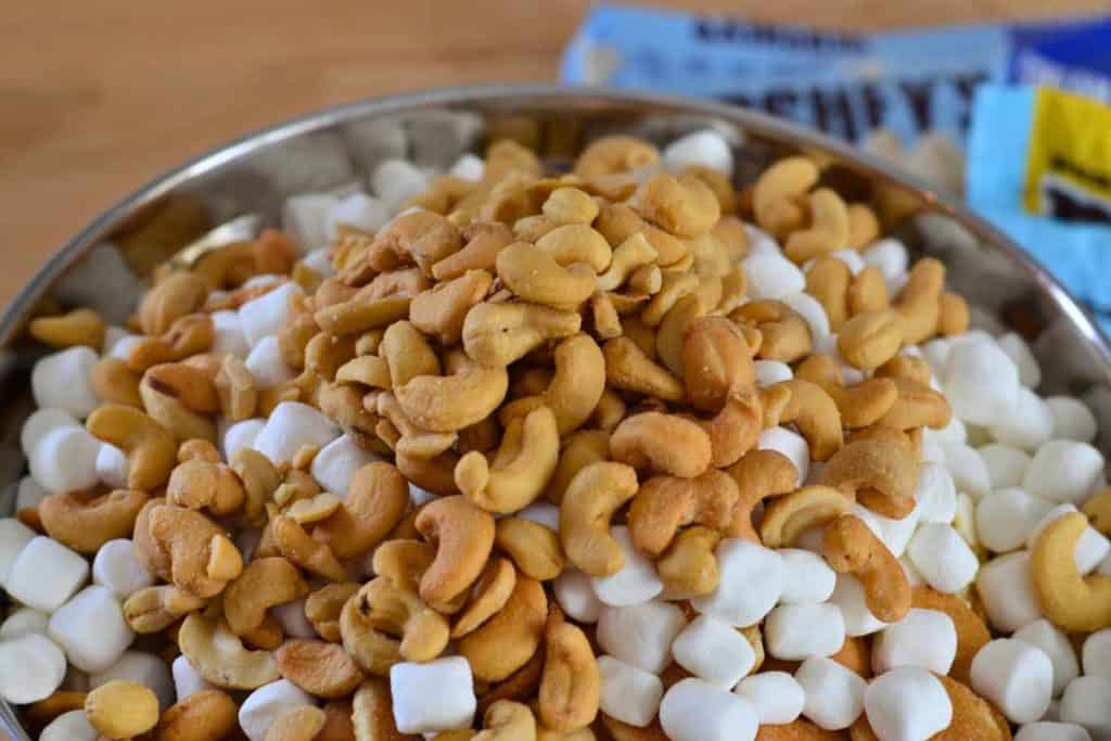 Cashews being added to the Easter Bunny Snack Mix recipe