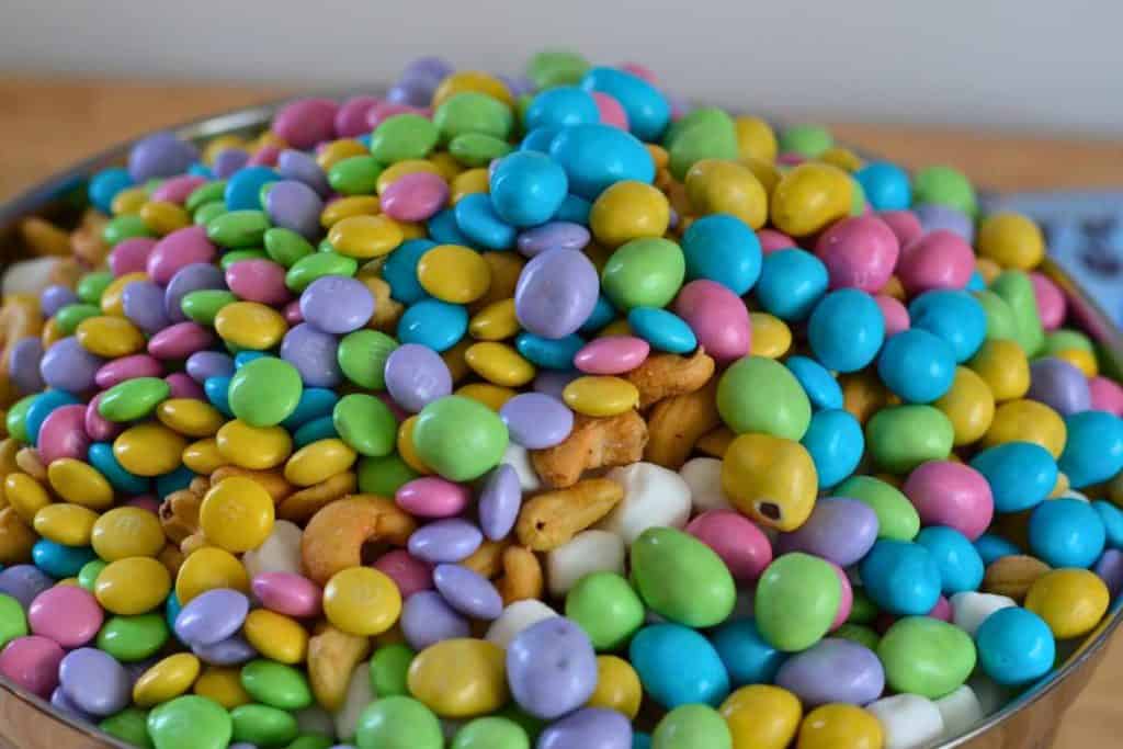 Peanut M&M's being added to the Easter Bunny Snack Mix recipe