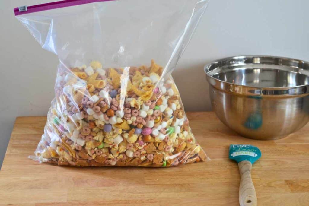 Easter snack mix in a large zip lock bag waiting to be mixed all up and combined