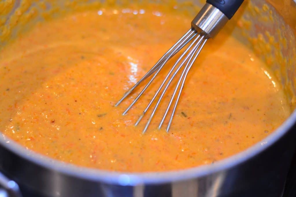 The sauce all mixed together and smooth, with cream cheese and parmesan cheese added as well