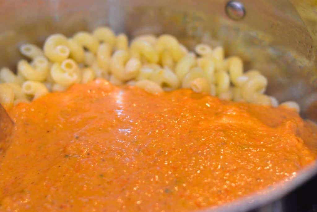 Roasted Cherry Tomato Pasta Sauce poured on top of the cooked pasta