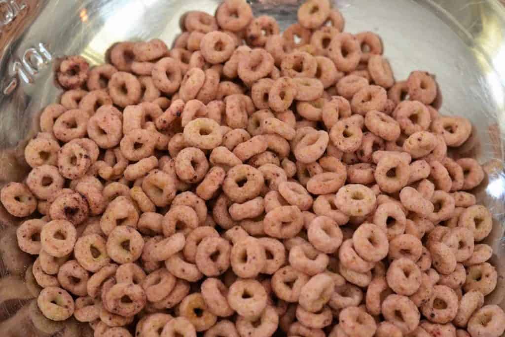 Very Berry Cheerios being added to the Easter Bunny Snack Mix recipe