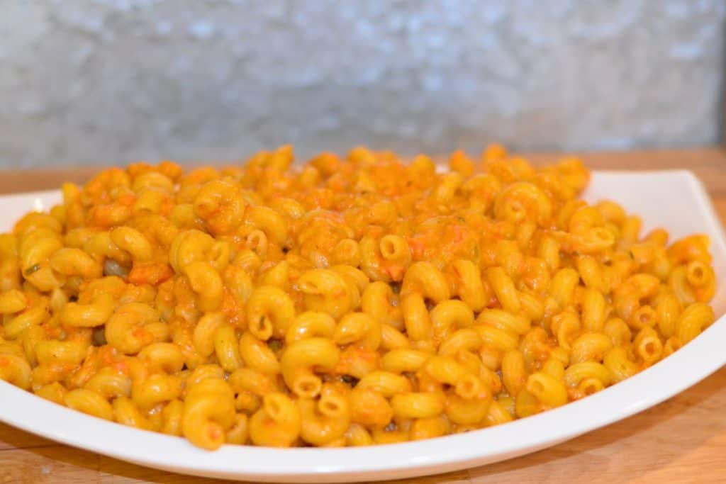 Close up of Roasted Cherry Tomato sauce with pasta on a serving platter