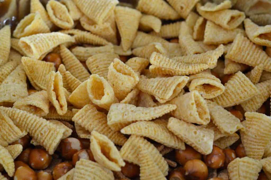 Bugle chips being added to the Easter Bunny Snack Mix recipe