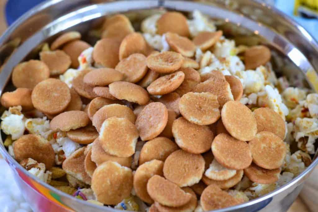 Nilla wafers being added to the Easter Bunny Snack Mix recipe