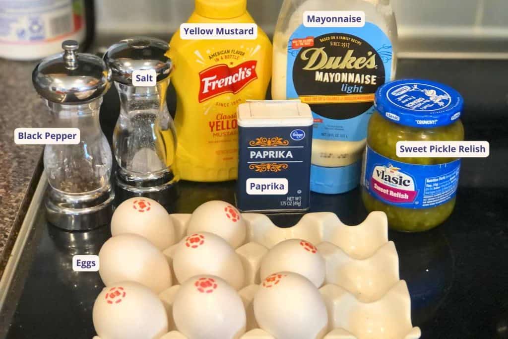 Ingredients for Classic Deviled Eggs including sweet pickle relish, eggs, paprika, mayonnaise, yellow mustard, salt and pepper.