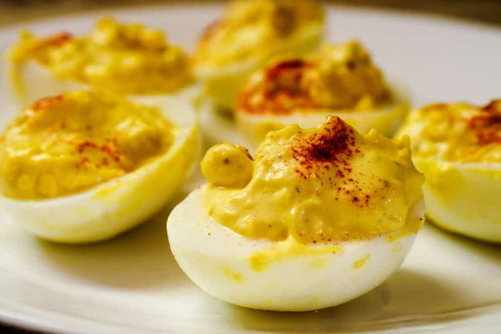 Tray of deviled eggs up close from the side