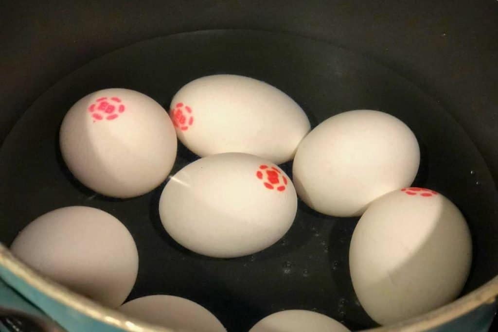 Eggs in a pot getting ready to be put on to boil
