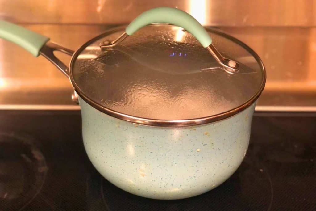 Pot of eggs taken off heat and lid put on to finish cooking