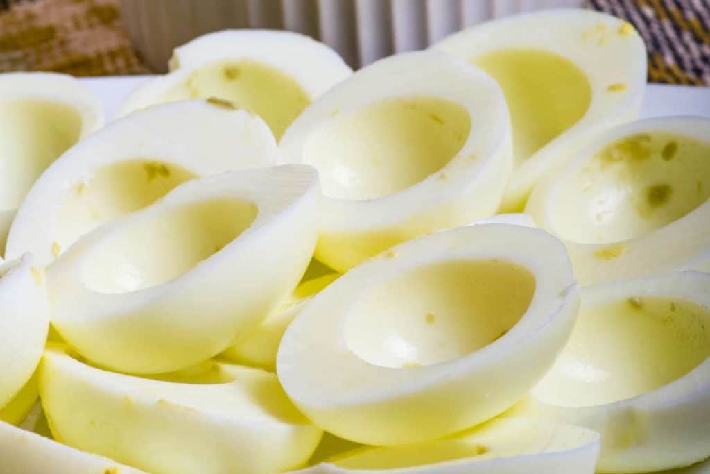 Hard boiled egg whites cut in half with the yolks removed