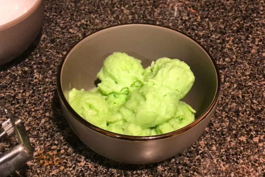 Gray bowl of lime kool-aid ice cream on the kicthen counter