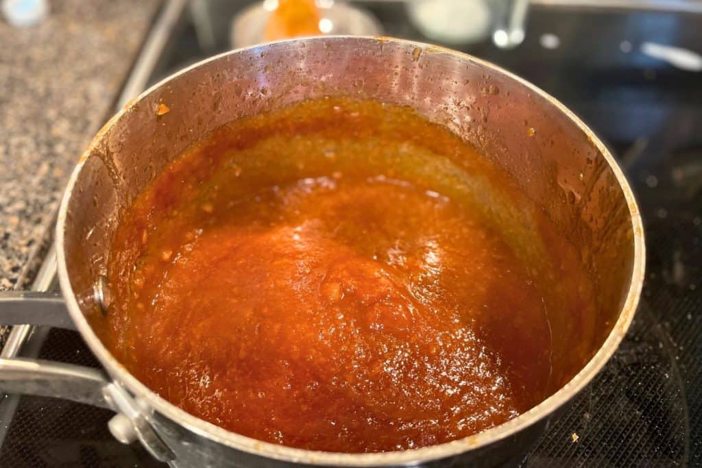Blended apple bbq sauce in a saucepan