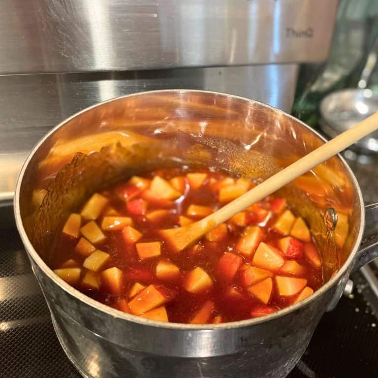 Sweet & Smoky Apple BBQ Sauce cooking on the stove in a sauce pan