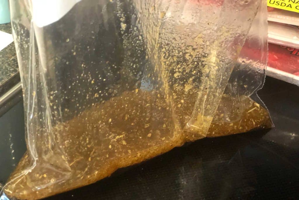 Ziplock bag full of marinade for Mediterranean beef kebabs
