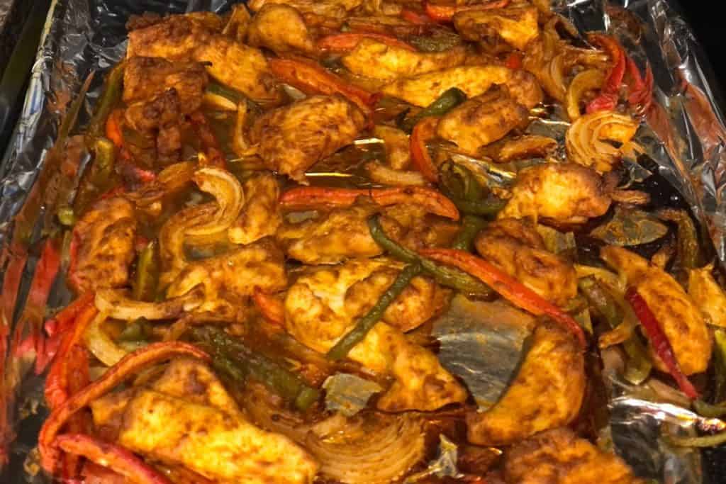 The roasted sheet pan of fajitas out of the oven and finished cooking.