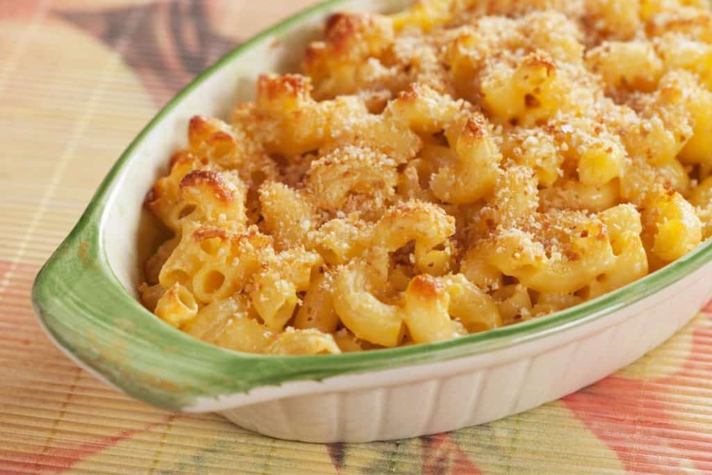 Smoked Cheddar Macaroni and Cheese recipe in an oval dish just out of the oven