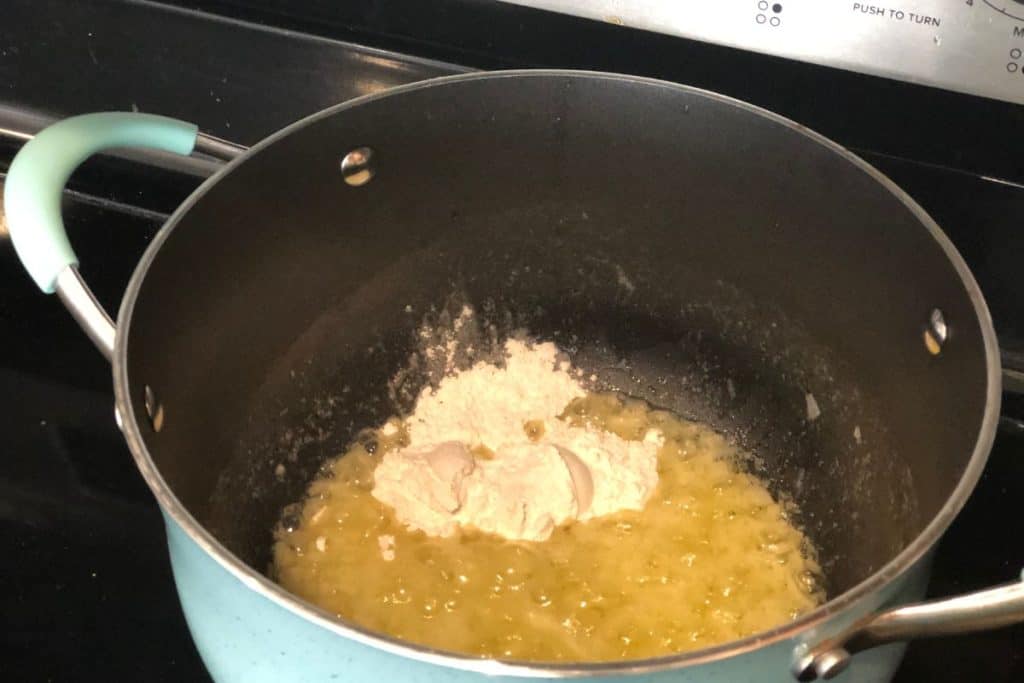 Flour added to butter and onion mixture in a large pot per the instructions of Smoked Cheddar Macaroni and Cheese recipe